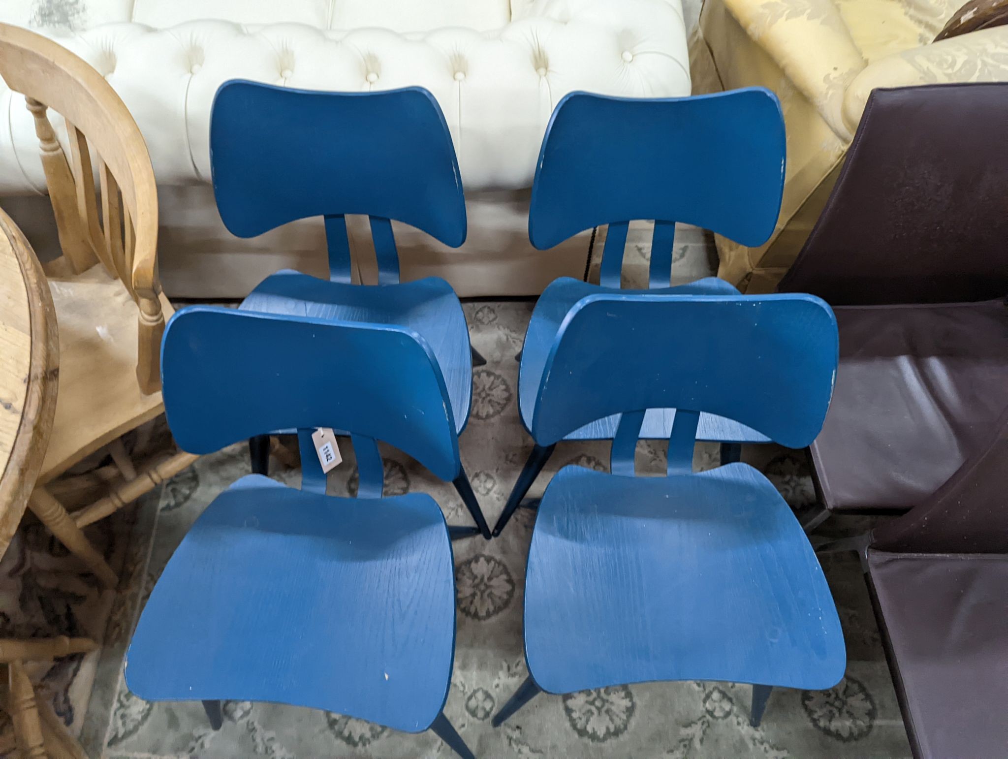 A set of four Ercol butterfly chairs